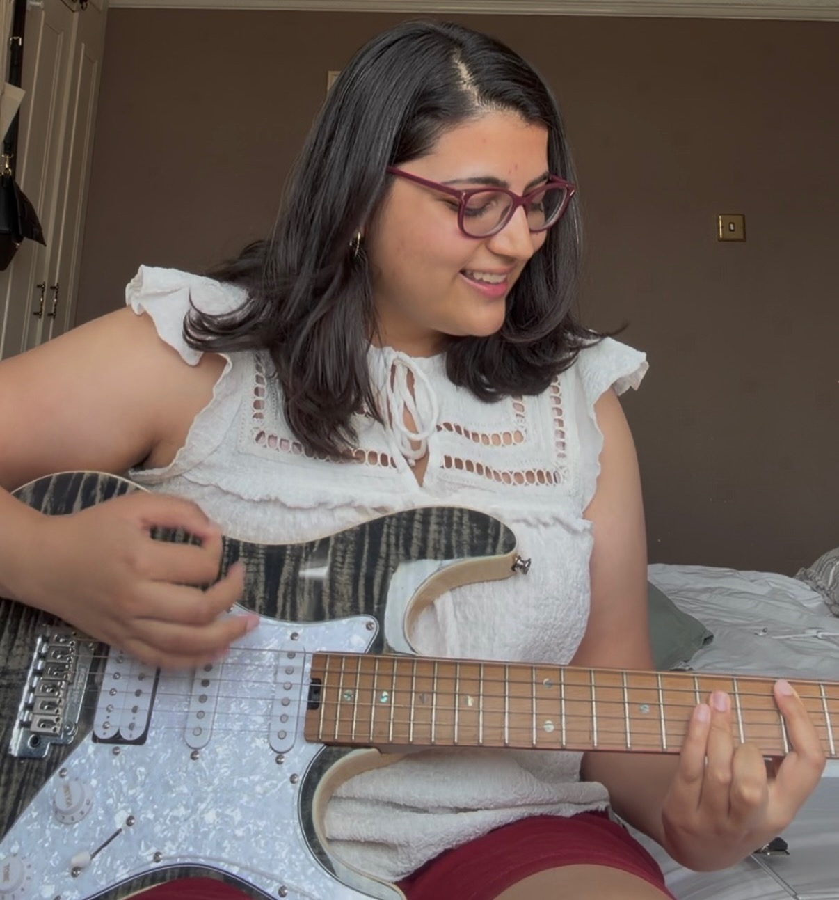Sania playing guitar